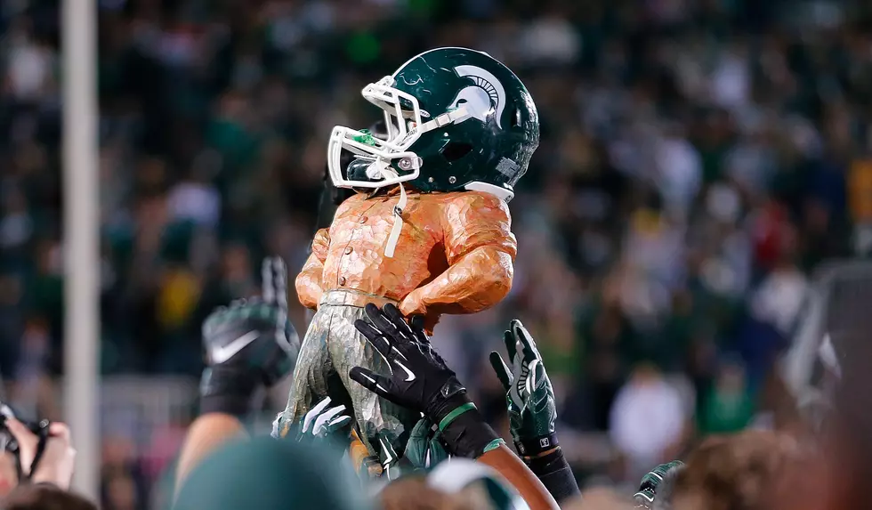 The Football Trophy No One Wants – 7 True Tales of Michigan’s Paul Bunyan Trophy